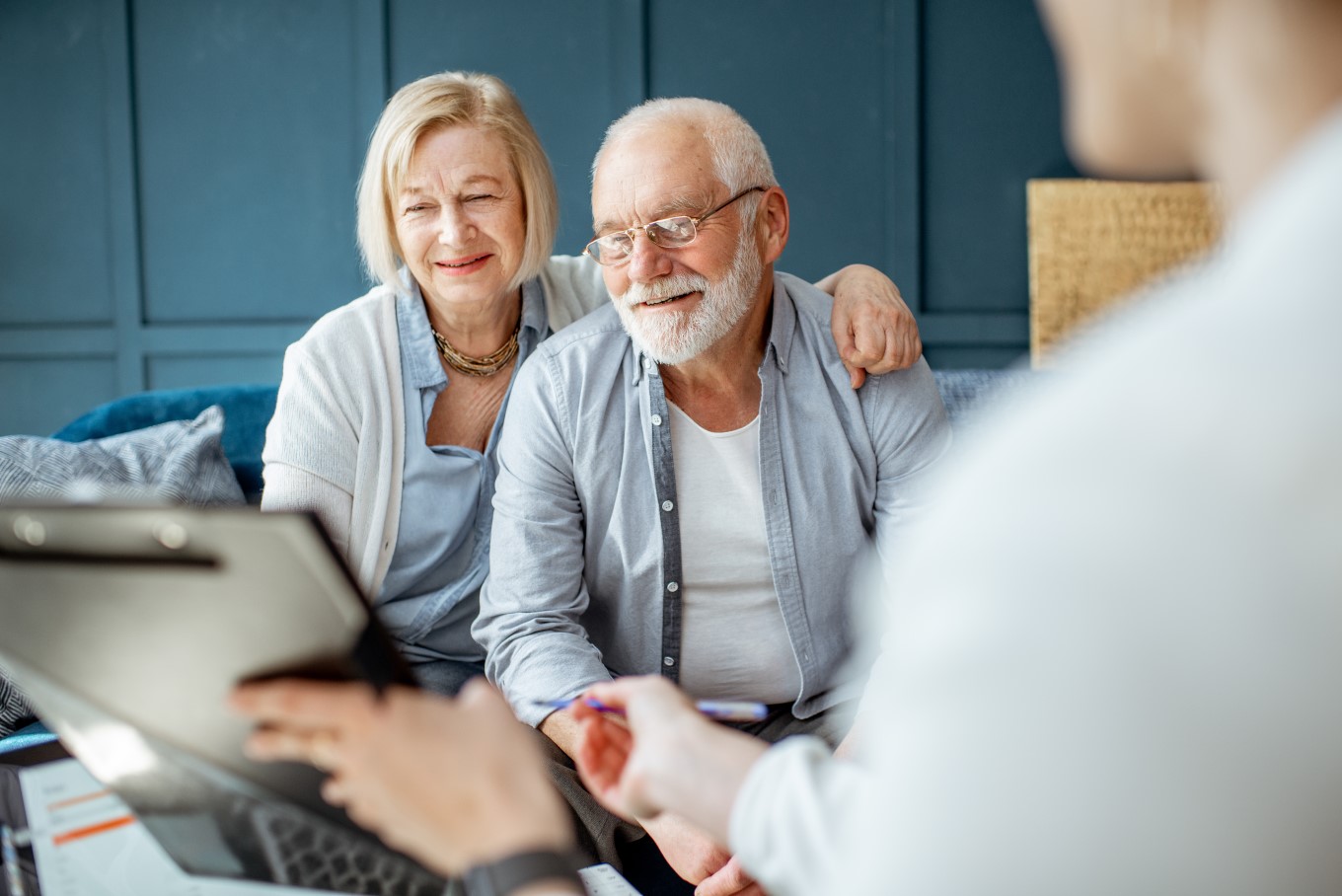 Happy senior couple during the meeting with a financial consultant